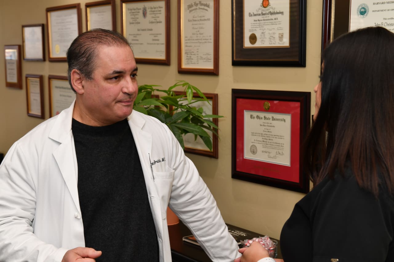 Dr. John Christoforidis with a patient
